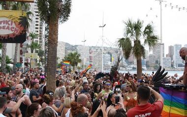 Thousands of people witness the Pride parade in the streets of Benidorm despite the rain